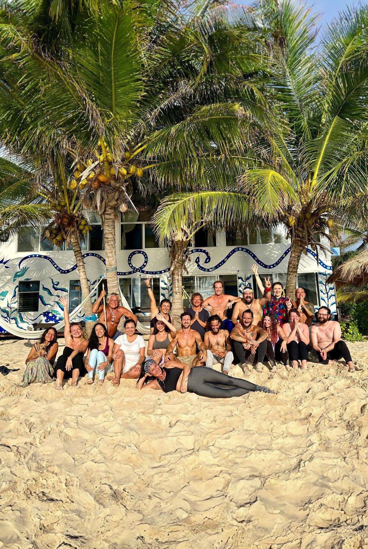 Retreat group at Pronoia — full group photo on the beach after ceremony